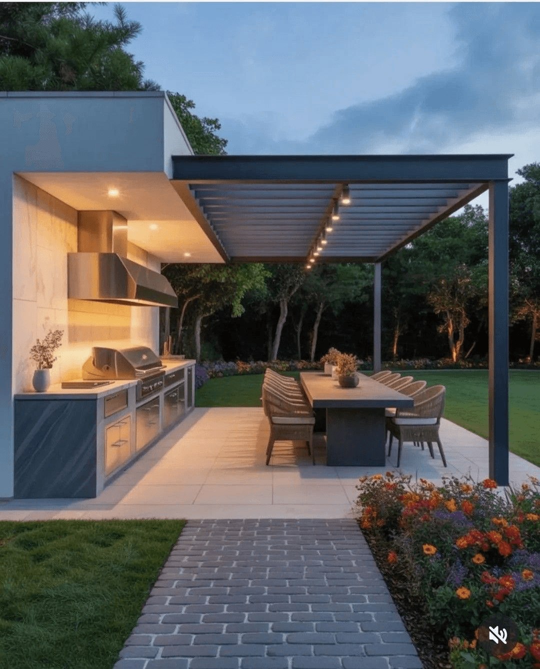 Outdoor kitchen and dining patio beneath a slatted pergola